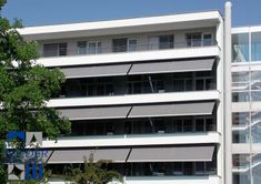 Guadalajara Ventanas edificio con toldos de brazo invisible 